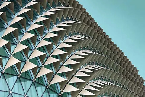 Modern skyscraper against blue sky
